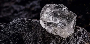 Raw and cut diamonds